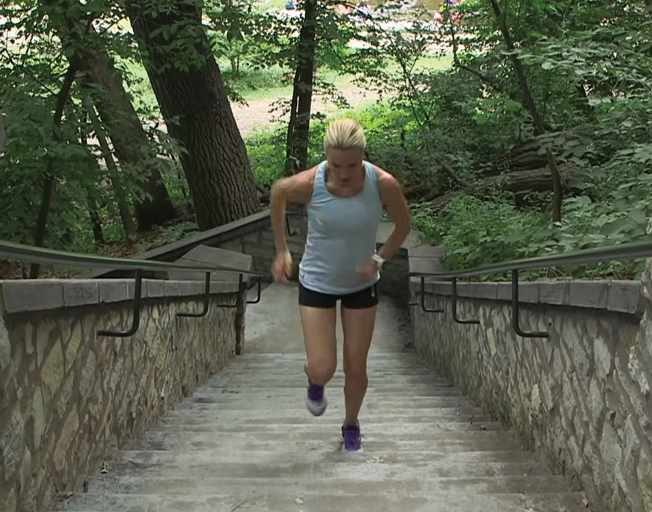 Woman running up stairs