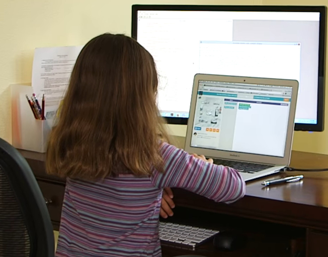 A child working on a computer