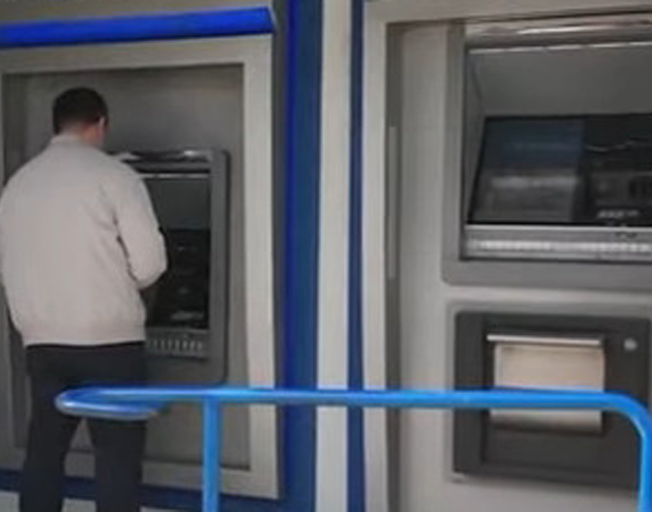 A man using an ATM