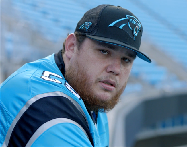 Luke Combs in Carolina Panthers hat and jersey