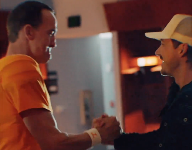 Peyton Manning and Morgan Wallen on locker room at Neyland Stadium in Knoxville, TN