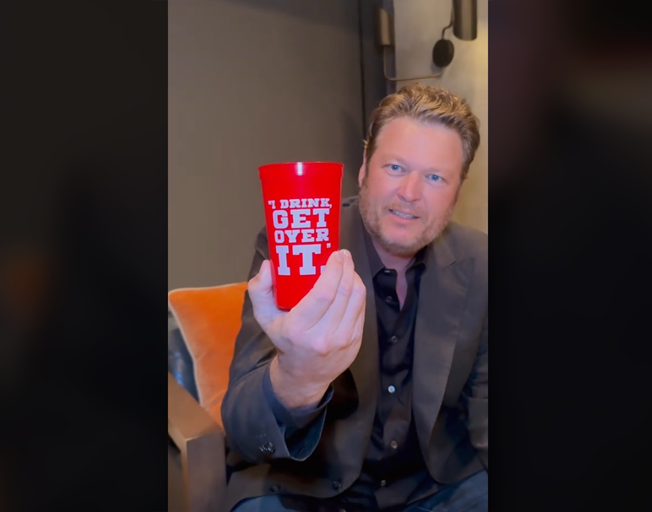 Blake Shelton holding a red cup