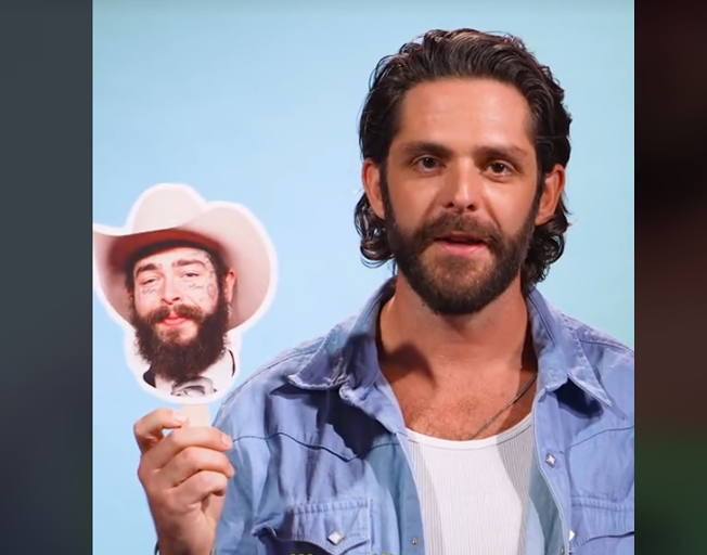 Thomas Rhett holding a picture of Post Malone